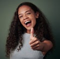 Happy woman, thumbs up and hand gesture, emoji and agreement with feedback isolated on green background. Yes, like and Royalty Free Stock Photo