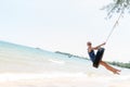 Happy woman on tire swing Royalty Free Stock Photo