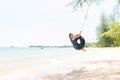 Happy woman on tire swing Royalty Free Stock Photo