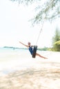 Happy woman on tire swing Royalty Free Stock Photo