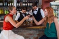 Happy woman toasting a red wine glass at bar counter Royalty Free Stock Photo