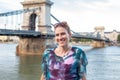 Happy woman with toothy smile at Chain Bridge, Budapest, Hungary Royalty Free Stock Photo