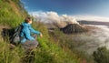 Happy woman tourist with backpacker enjoying sunrise view at hi Royalty Free Stock Photo