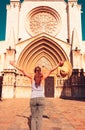 Happy woman tourist enjoying beautiful cathedral