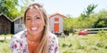 Happy woman tourist enjoying outdoor walk in casual standing smiling at camera in biganos port in outdoor female portrait concept