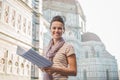 Happy woman tourist with map listening to audio guide, Florence Royalty Free Stock Photo