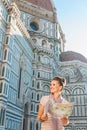 Happy woman tourist with map looking on something near Duomo Royalty Free Stock Photo
