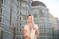 Happy woman tourist with map standing in front of Duomo, Italy Royalty Free Stock Photo