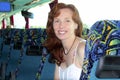 Happy woman tourist traveling bus indoor Royalty Free Stock Photo