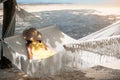 Happy Woman Traveler is relaxing in a hammock on the paradise beach. Female tourist in yellow dress rest near tropical sea. Royalty Free Stock Photo