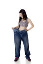 Happy woman trying her old jeans on studio Royalty Free Stock Photo