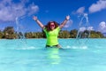 Happy woman in a turquoise lagoon on the beautiful island of Tahaa Royalty Free Stock Photo