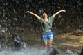 Happy woman under waterfall Royalty Free Stock Photo