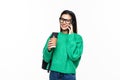 Happy woman university student with backpack and books talking on phone, looking out of frame, isolated on white background Royalty Free Stock Photo