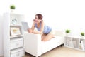 Happy woman using tablet pc on sofa Royalty Free Stock Photo