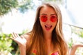 Happy woman at the vacation sea hotel, girl in red sunglasses is happy, summer concept Royalty Free Stock Photo