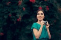 Happy Woman with Vintage Camera at a Garden Party Event