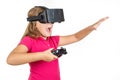 Happy woman with virtual reality headset and joystick playing vr games