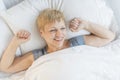 Happy Woman Waking Up In Bed Royalty Free Stock Photo