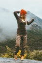 Happy woman walking alone in foggy mountains Royalty Free Stock Photo