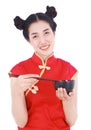 Happy woman wearing chinese cheongsam dress with chopsticks and Royalty Free Stock Photo