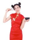 Happy woman wearing chinese cheongsam dress with chopsticks and Royalty Free Stock Photo