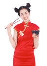 Happy woman wearing chinese cheongsam dress with chopsticks and Royalty Free Stock Photo