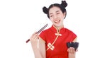 Happy woman wearing chinese cheongsam dress with chopsticks and Royalty Free Stock Photo