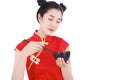 Happy woman wearing chinese cheongsam dress with chopsticks and Royalty Free Stock Photo