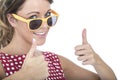 Happy Woman Wearing Yellow Sun Glasses Giving Thumbs Up Royalty Free Stock Photo