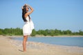 Happy woman in white dress on the beach Royalty Free Stock Photo