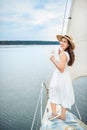 Woman with glass of champagne resting on boat Royalty Free Stock Photo