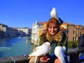 Happy woman with white pigeons ,Venice Royalty Free Stock Photo