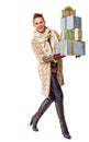 Happy woman on white with pile of Christmas giftes walking Royalty Free Stock Photo