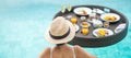 Happy woman in white swimsuit having Floating Breakfast tray in luxury pool hotel, young female with hat enjoy in tropical resort Royalty Free Stock Photo