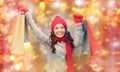 Happy woman in winter clothes with shopping bags Royalty Free Stock Photo