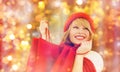 Happy woman in winter clothes with shopping bags Royalty Free Stock Photo