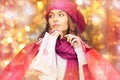 Happy woman in winter clothes with shopping bags Royalty Free Stock Photo