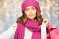 Happy woman in winter clothes with shopping bags Royalty Free Stock Photo