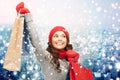 Happy woman in winter clothes with shopping bags Royalty Free Stock Photo