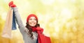 Happy woman in winter clothes with shopping bags Royalty Free Stock Photo