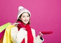 Woman in winter clothes and shopping for christmas gifts Royalty Free Stock Photo