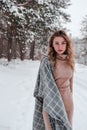 Happy woman on the winter forest background. Young pretty girl in the woods outdoors. Portrait of a cheerful beautiful Royalty Free Stock Photo