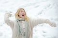 Happy woman in winter hold Snow ball. Wintertime. Snowball and winter fun. Cute playful young girl outdoor enjoying Royalty Free Stock Photo