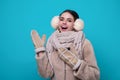 Happy Woman in winter warm hat and Winter gloves. Smiling girl in woolen coat. Girl in winters cloth. Young woman in