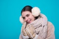 Happy Woman in winter warm hat and Winter gloves. Smiling girl in woolen coat. Girl in winters cloth. Young woman in