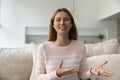 Happy woman with wireless earphones in ears shot portrait