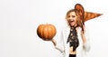 Happy woman in witch hat with pumpkin. Preparation Halloween holidays. Smiling witch girl with jack-o-lantern. Halloween