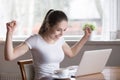 Excited woman celebrating online success or lottery win Royalty Free Stock Photo