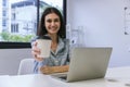 Happy woman working at the office with cups of coffee. businesswoman drinking coffee Royalty Free Stock Photo